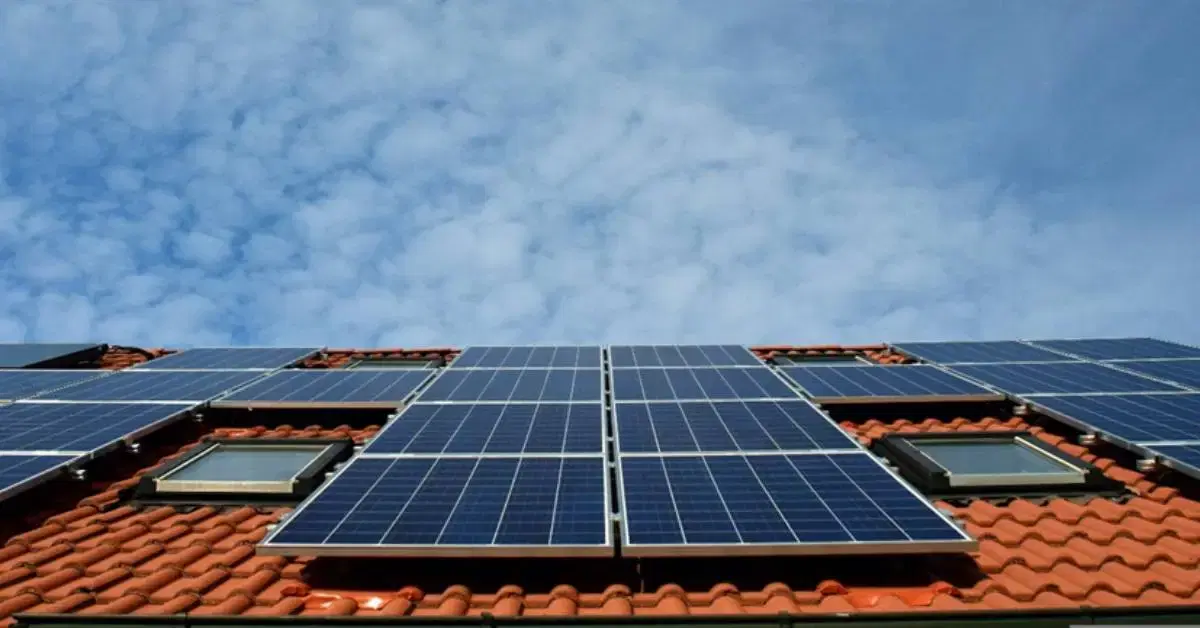 Solar panels on modern rooftop with bright sky